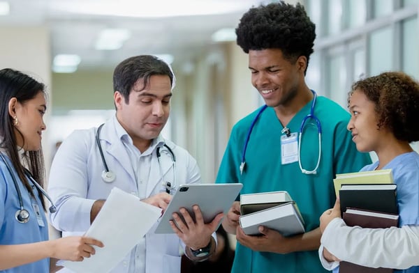 Nursing students with medical instructor
