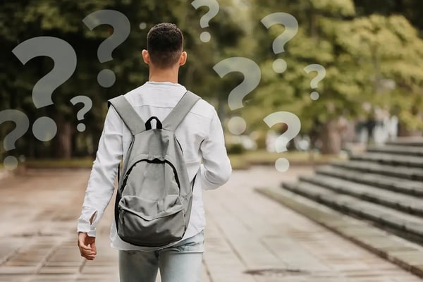 student walking away with backpack